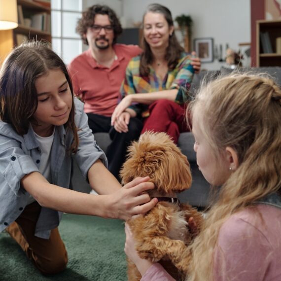 Family Gathering with Pet Dog in Living Room
