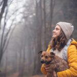 Woman with dog in forest