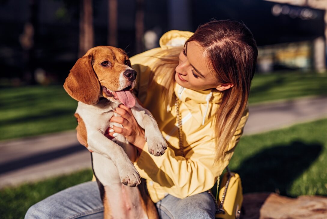 Young woman with dog in park