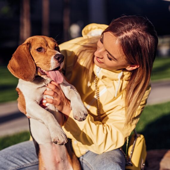Young woman with dog in park